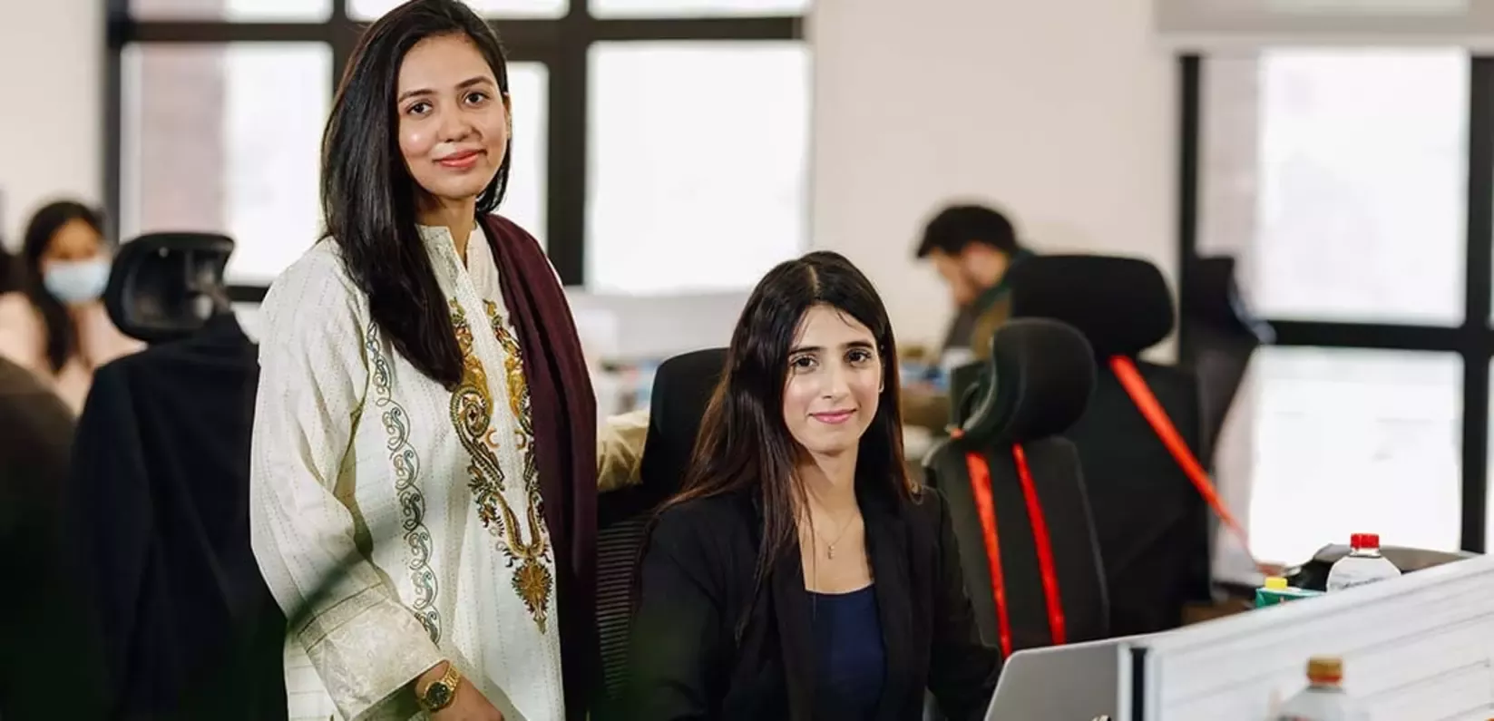 women-office-discussion-wide